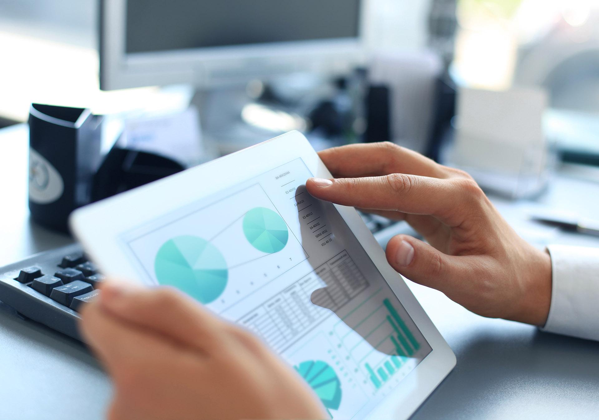 Business,Person,Analyzing,Financial,Statistics,Displayed,On,The,Tablet,Screen